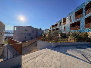a view of an apartment building with a balcony at Design Apartment Archea Terrazza sul Lago Maggiore in Laveno-Mombello
