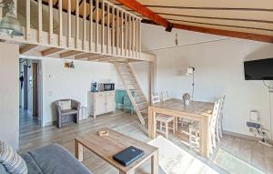 a living room with a loft bed and a table at Stunning Apartment In Bredene With Wifi in Bredene