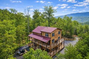 an overhead view of a house in the woods at Smoky Mountain Cabin, Sleeps 12, 2 Kitchens & Hot Tub in Pigeon Forge