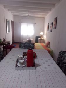 a room with a table and a room with a bed at El Jacaranda in Carmen de Patagones +3 photos