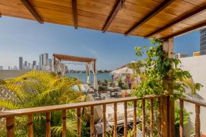 a balcony with a view of the water at Hotel Dorado Plaza Boutique Calle del Arsenal in Cartagena de Indias
