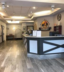 a lobby of a hotel with a reception counter at One Bedroom Mountain View Condo - Lodges at Canmore in Canmore +17 photos