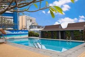 a swimming pool in the middle of a building at Ocean Hotel Guangzhou in Guangzhou