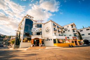 a building with a sign on the front of it at Hotel Ruinas Resort in Huehuetenango +63 photos