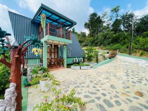 a house on the beach with a playground at Cinnamon Crown in Matara