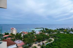 an aerial view of a city and the ocean at Top Floor Studio Non-Resort Unit Tambuli Tower D in Maribago