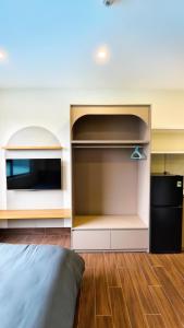 a bedroom with a bed and a large closet at 4Chan Phúc Đồng Apartment in Hanoi