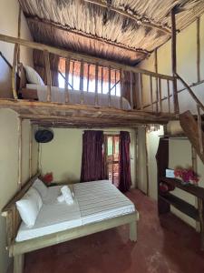 a bedroom with a bunk bed in a room at Tyler's place in Coco