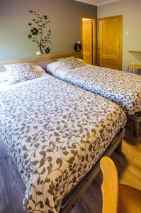 Posteľ alebo postele v izbe v ubytovaní Hostal La Pastora
