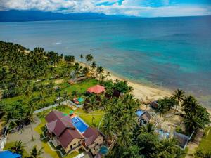 an aerial view of a resort on the beach at H&P Beach Resort in Pandan