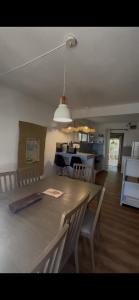a dining room and kitchen with a table and chairs at Thelazycoco in Blue Bay