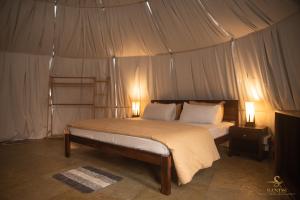 a bedroom with a bed in a tent at Sands - Tajpur in Tajpur +105 photos