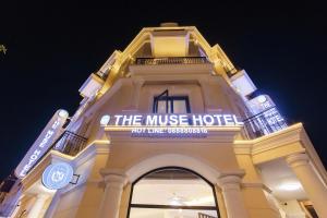 a building with a sign on the music hotel at The Muse Hotel 2 in Ðố Sơn +149 photos