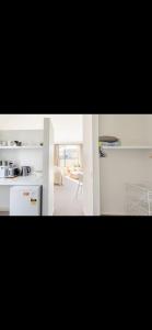a room with a kitchen and a living room at Retreat to Pisa in Mount Pisa
