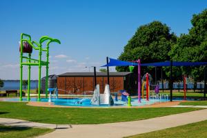 a water park with a playground with a water slide at Bank's Place in Yarrawonga