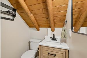 a bathroom with a sink and a toilet at Forest Hideaway Near Sedona in Munds Park +18 photos