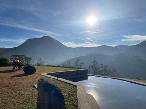 a swimming pool with a view of mountains at Royal Mountain Edge ,Knuckles in Rangala
