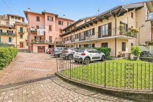 a group of cars parked in a parking lot at Sunset in Baveno: 1 Bed with Balcony - Happy Rentals in Baveno +18 photos