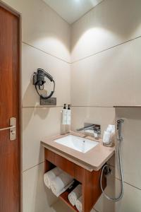a bathroom with a sink and a shower at Playsales SSR in Indore