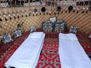 a room with two beds in a yurt at eco house "QUMUSH YURT" in Emgekchil +31 photos