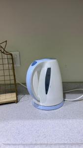 a toaster sitting on the floor in a room at فيلا الكادي in Al Hada