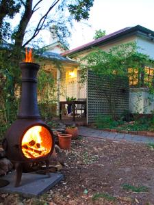 a fire oven in the yard of a house at The old Chiltern bank BnB in Chiltern