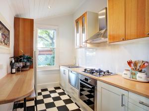 a kitchen with a stove and a counter top at The old Chiltern bank BnB in Chiltern