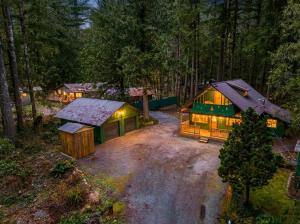 an aerial view of a cabin in the woods at night at Ravens Retreat in Index