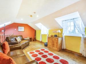 a living room with a couch and a table at Smugglers View Nr Whitby in Ravenscar