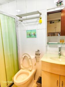 a bathroom with a toilet and a sink at 2B-03 Condo Staycation at Megatower 1 in Baguio