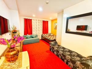 a living room with a couch and a bed at 2B-03 Condo Staycation at Megatower 1 in Baguio