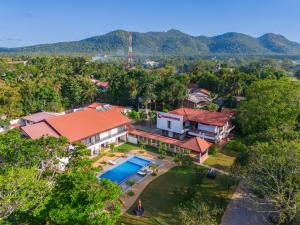 an aerial view of a house with a swimming pool at The Grand Moon River Hotel in Kataragama