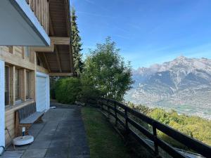 a porch of a house with a view of a mountain at Pet-friendly chalet in Veysonnaz in Veysonnaz