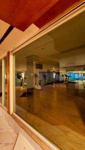 a view of a living room with a large glass window at Eastpana 304 R2 Hotel in Si Maha Phot