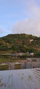 a view of a hill with a mountain in the background at CLAUDIA Blessings in Saint Gabriel