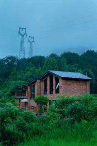 an old brick house in the middle of a field at 伴山一墅 in Chaoyang +8 photos