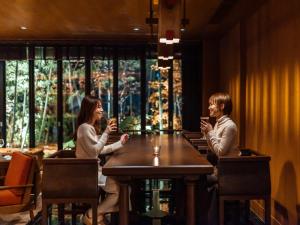two women sitting at a table with their drinks at Mercure Hida Takayama in Takayama +160 photos