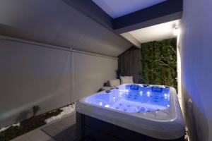 a jacuzzi tub in the middle of a room at Edem in Larisa +41 photos