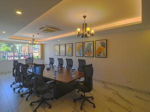 a conference room with a long table and chairs at Yaya Hotel & Apartments in Nairobi