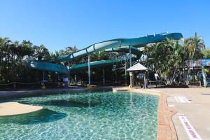 a large swimming pool with a water slide at Quest Chermside in Brisbane