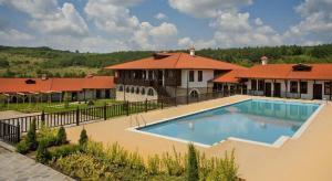 a large swimming pool in front of a house at A&N Residence Bolyarka in Arbanasi