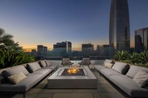 a living room with a couch and a fire pit at Spera in San Francisco