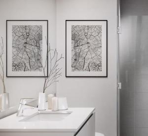 a bathroom with two pictures on the wall and a sink at Spera in San Francisco +11 photos