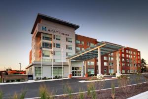a building with a parking lot in front of it at Hyatt House Oak Brook in Oak Brook