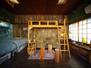 a bedroom with a bunk bed and a ladder at Wonderlust Inn in Kamakura +110 photos