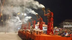 a group of men standing on a stage in a performance at DS Residency-Near Varanasi Jn Railway station N Temples-Parking-Free Wi-Fi in Varanasi