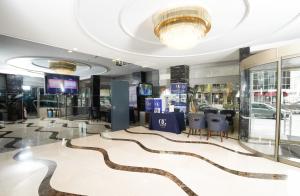 a hotel lobby with a snake carpet at ARMİS HOTEL in İzmir