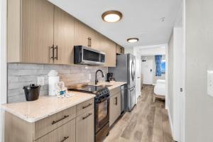 a kitchen with a sink and a stove top oven at Compass Cove 1466 in Myrtle Beach