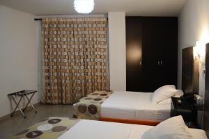 Ένα ή περισσότερα κρεβάτια σε δωμάτιο στο Hotel Calima Real