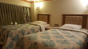 Кровать или кровати в номере Aldem Hotel